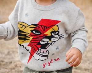 Close up of kids light grey tiger and lightning bolt sweater. 