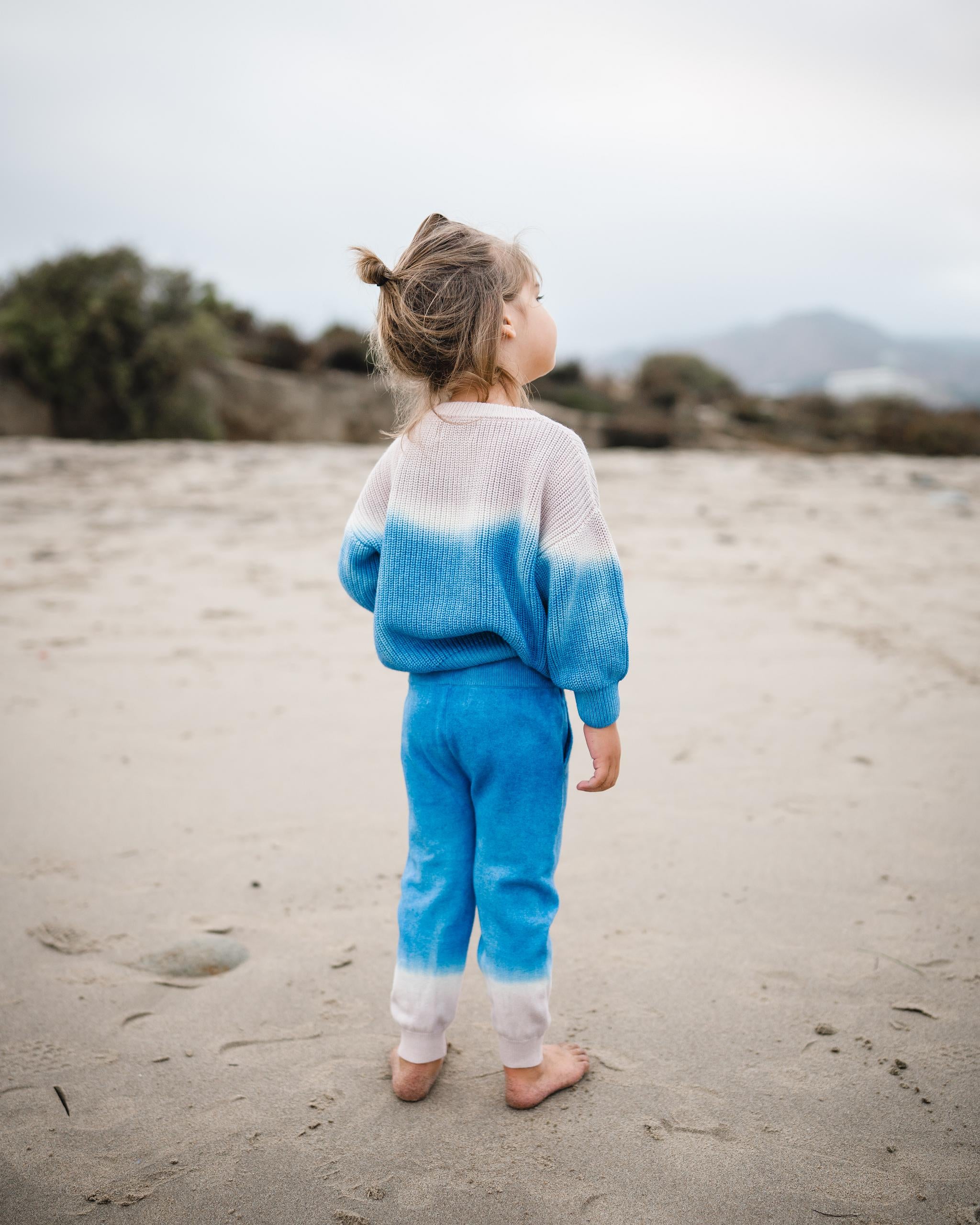 Back of kids blue dip dye sweater and matching sweatpants. 