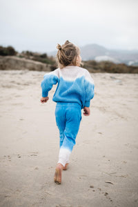 Back of kids blue dip dye sweater and matching sweatpants. 