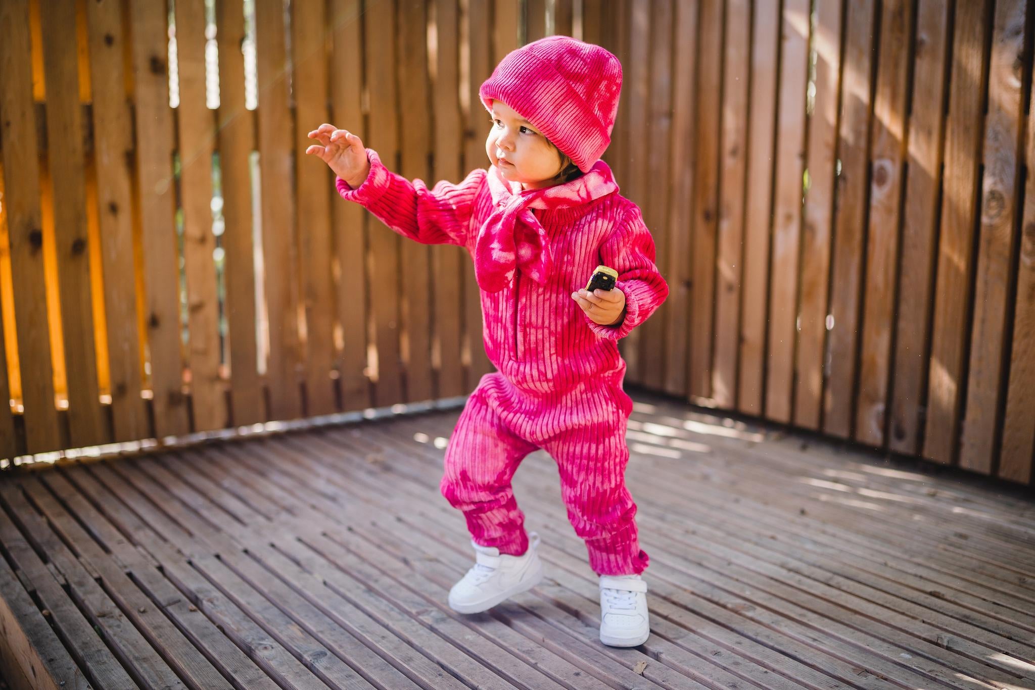 Kids matching fuchsia beanie hat, scarf and onesie. 