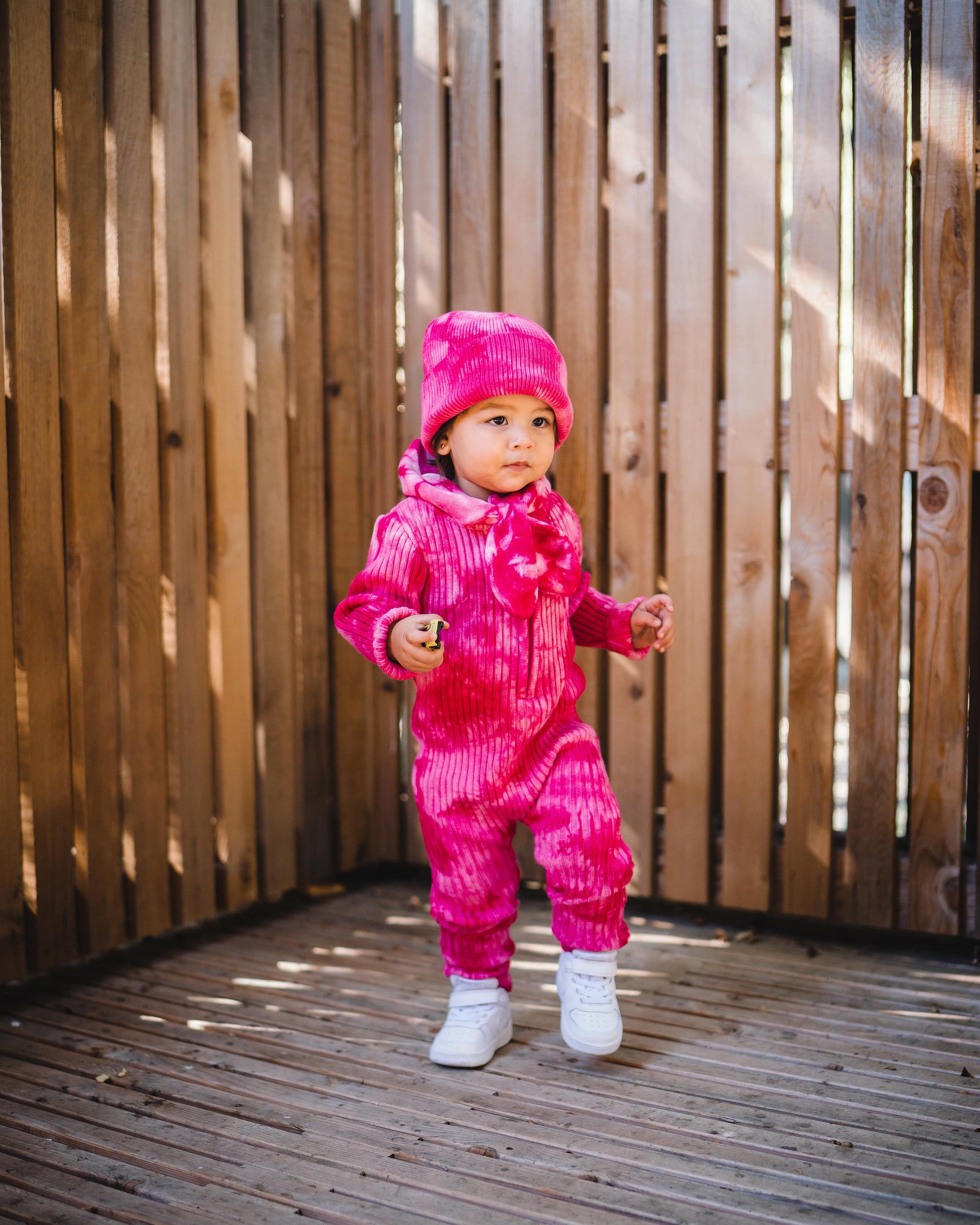 Kids matching fuchsia beanie hat, scarf and onesie. 