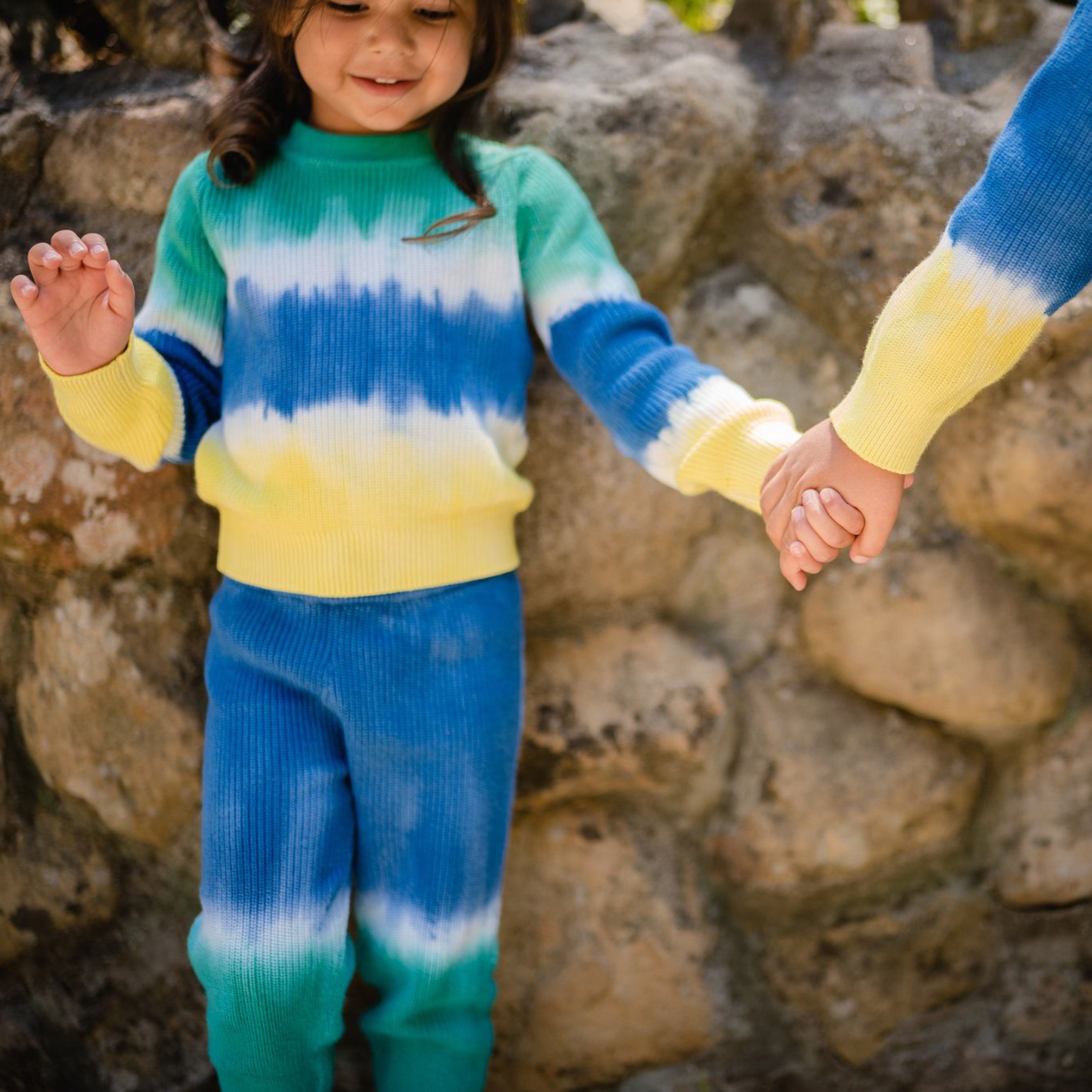 Green, blue and yellow dip dye sweater front. 