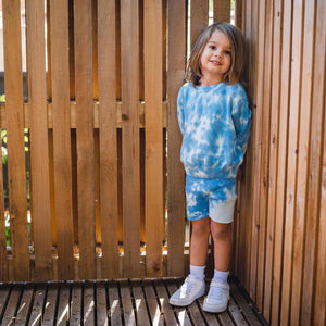 Kids light blue tie dye sweater and shorts. 